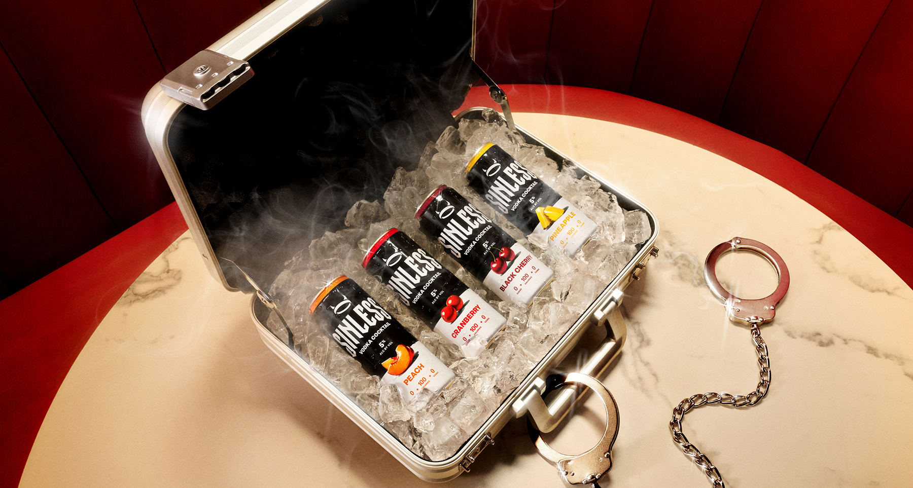 A suitcase of Sinless Vodka Cocktails sitting on ice.